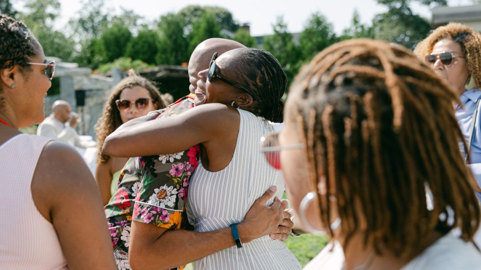 Black alumni embrace during the Bruno on the Vineyard event.
