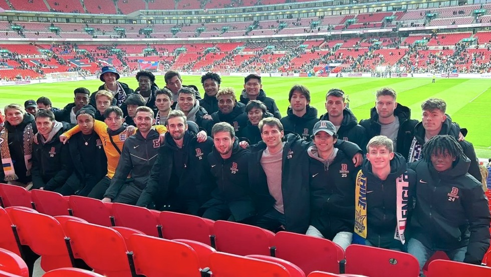 Brown men's soccer team attending a game at Wembley Stadium.