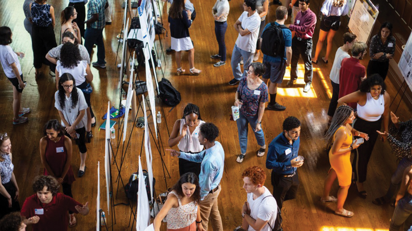 Students inside Sayles Hall during the Summer Research Symposium
