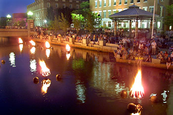 WaterFire torches at night