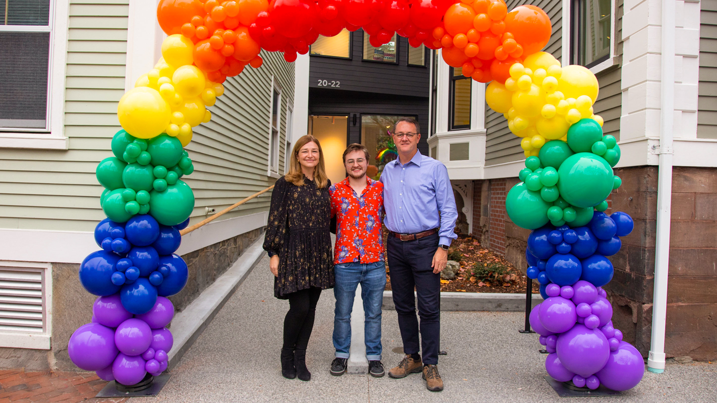 Katie, Rowan, and Brent Gledhill outside of Stonewall House during its opening event.