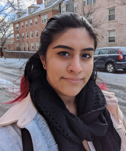 Maya Martinez outside on the Brown campus during winter