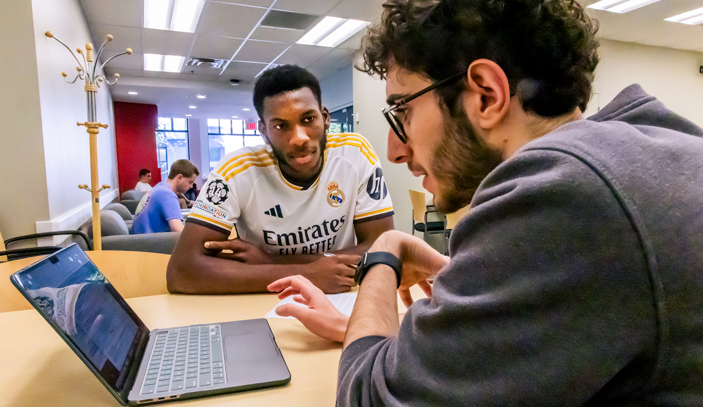 A peer career advisor at the Center for Career Exploration helps a fellow student during an advising appointment at the center.