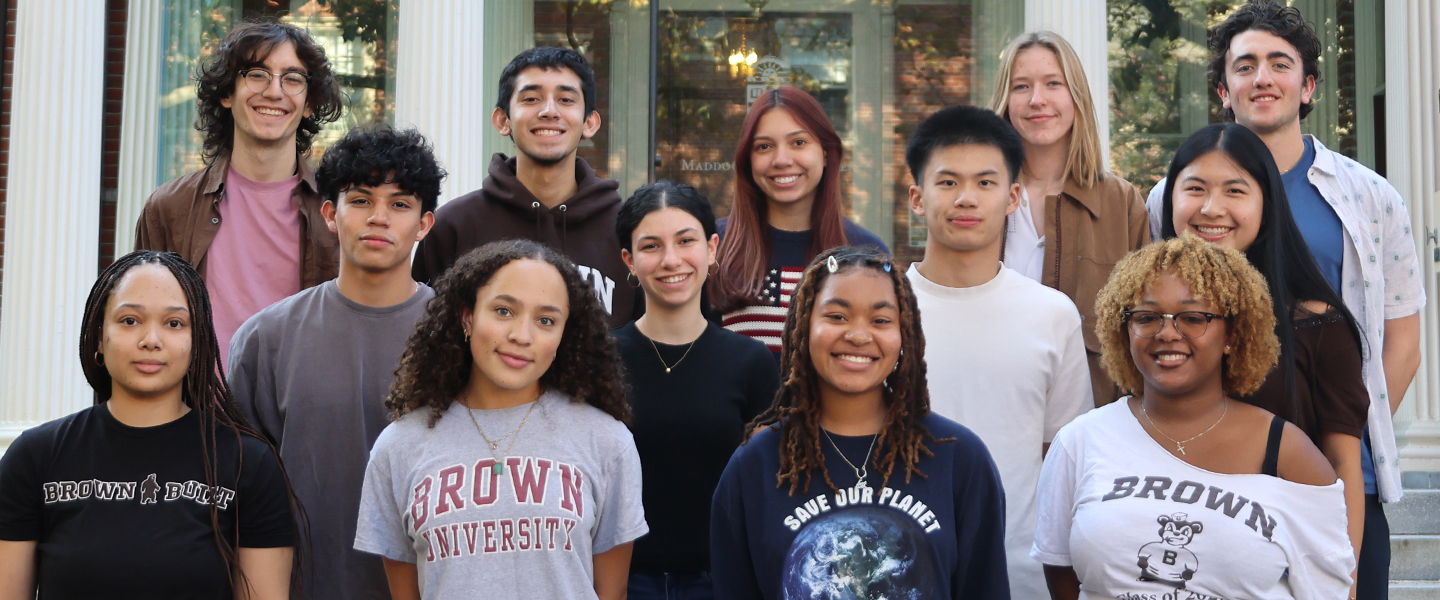 A group of student callers stand outside of the Maddock Alumni Center, where the student call center is located.