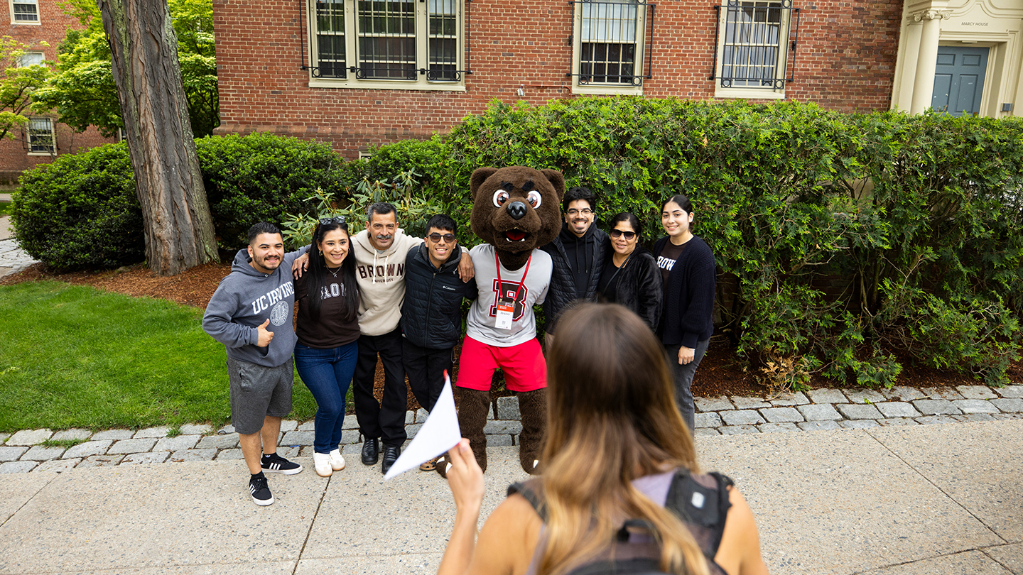 Bruno and alums posing for a photo at Reunion 2025