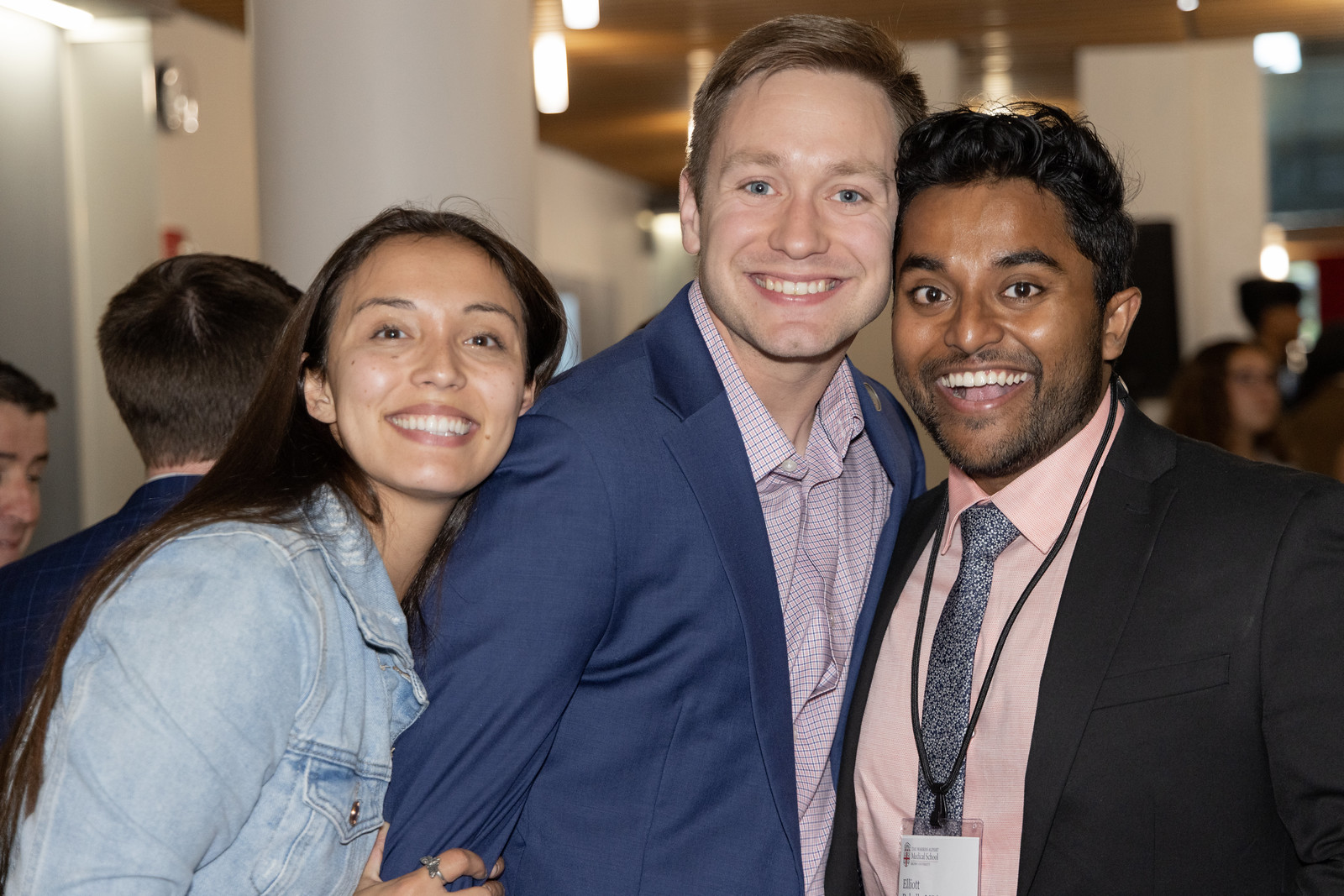 Three medical alumni pose for a photo at Medical Reunion Weekend event.