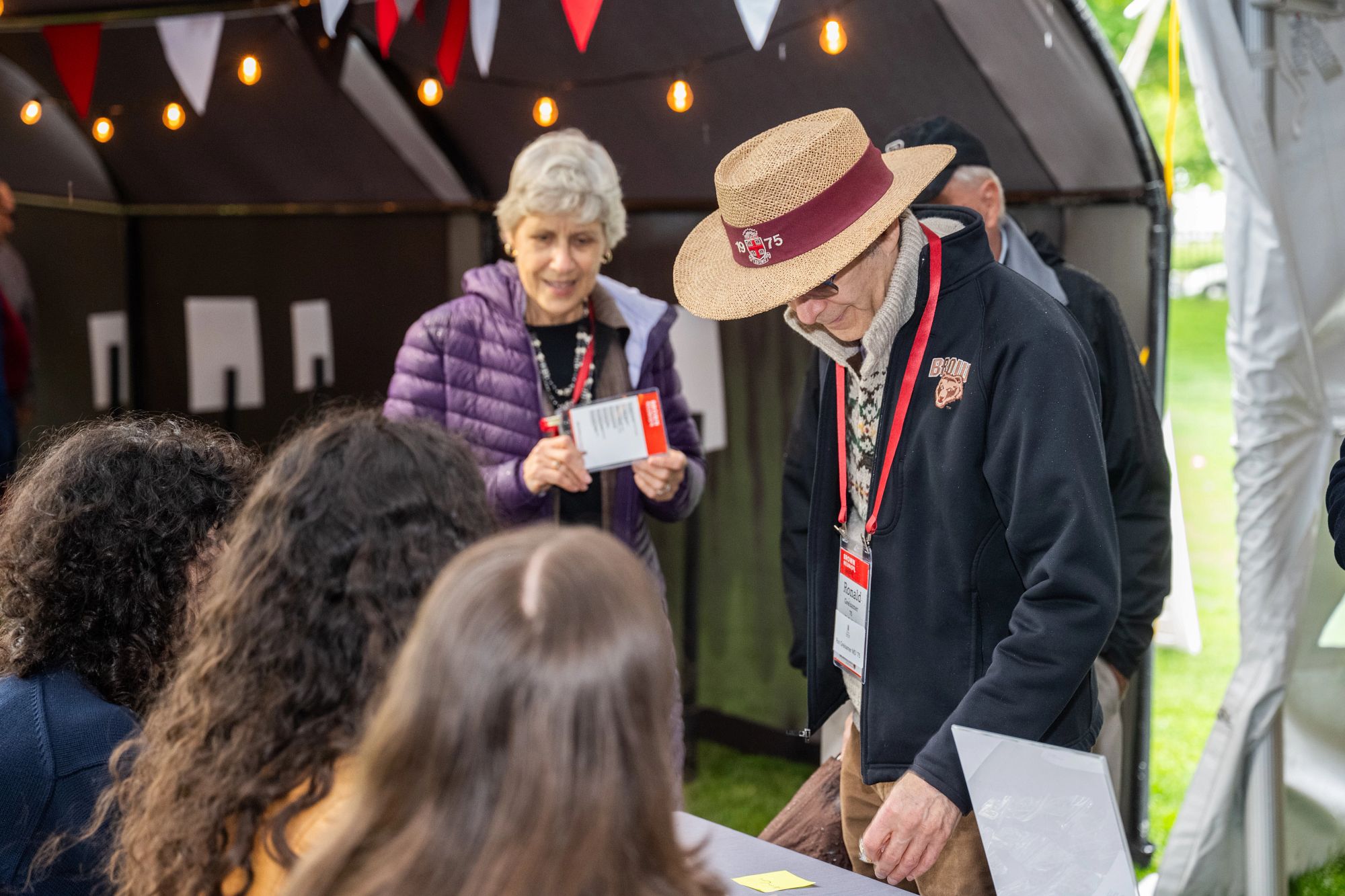 alums checking in outside reunion tent