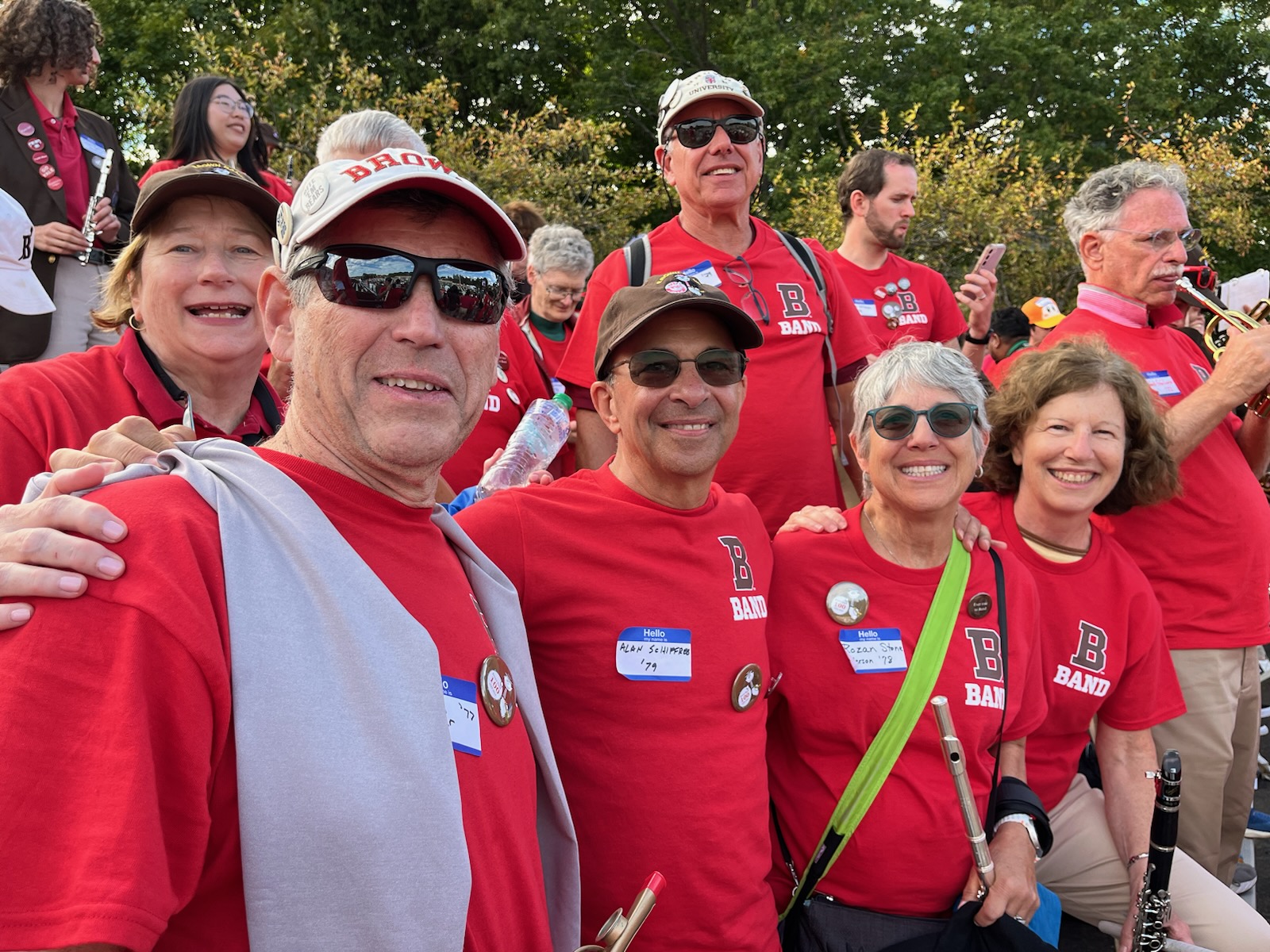 Rozan poses with former bandmates.