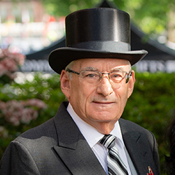 Art Corvese wearing a top hat as a Reunion Marshal 