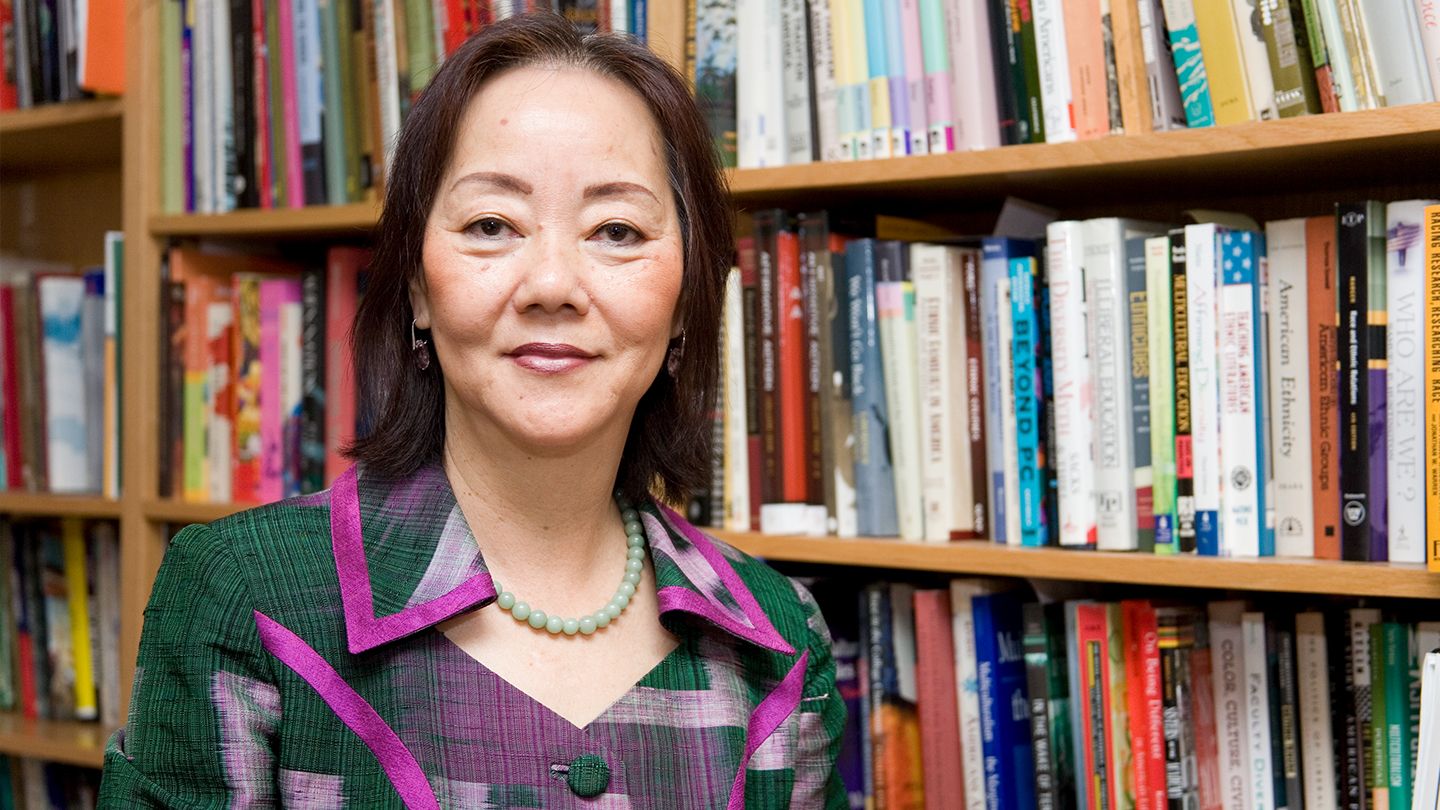 Evelyn Hu-DeHart photographed in front of bookshelves.