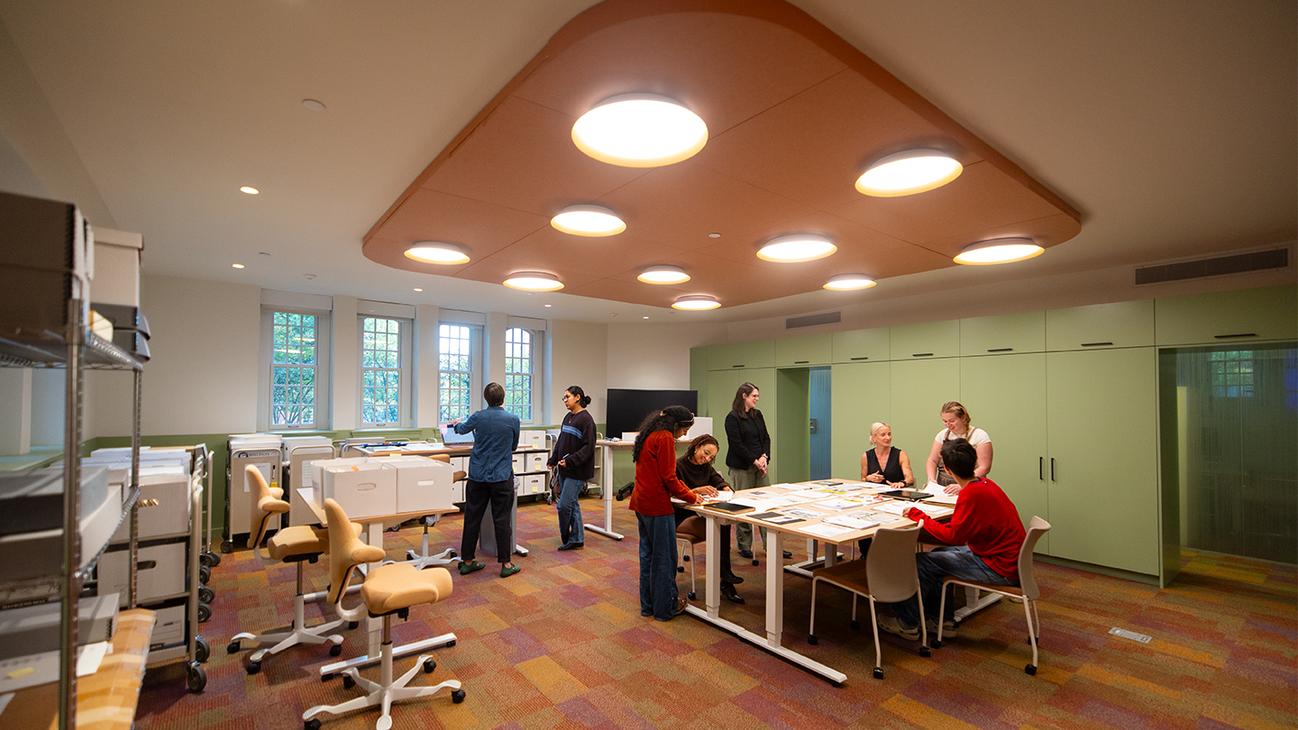 People working and in discussion inside the renovated Pembroke Center.