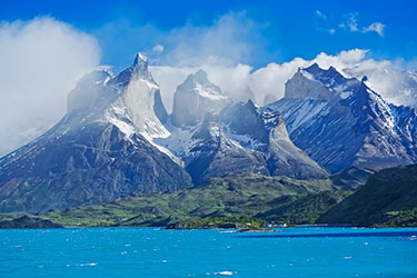 jagged mountains with lake in foreground