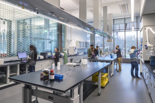 Students and staff working in a lab at the Engineering Research Center
