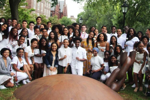 Members of the Black Student Union posing by the Slavery Memorial on the Quiet Green.