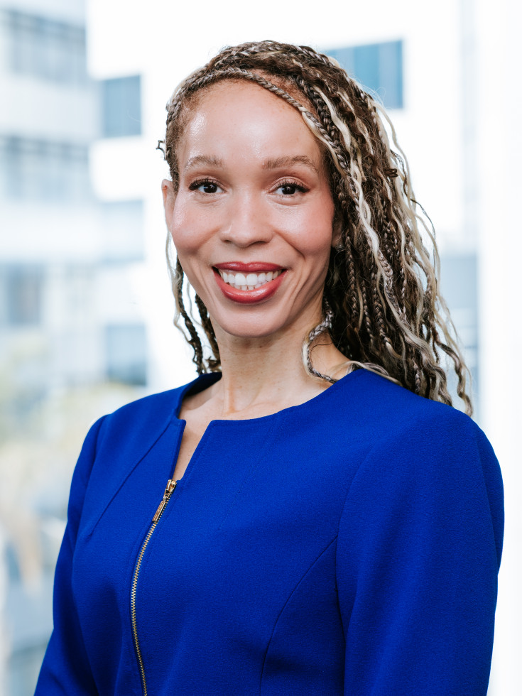 Portrait of Melba Melton smiling in a blue jacket 
