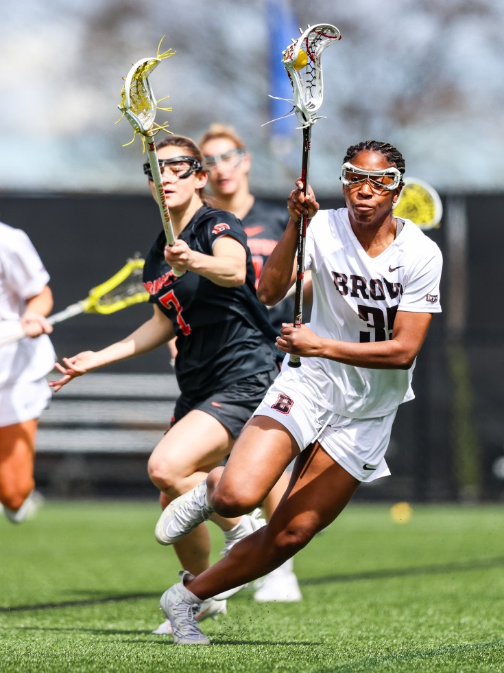 Codi Johnson playing in a lacrosse game