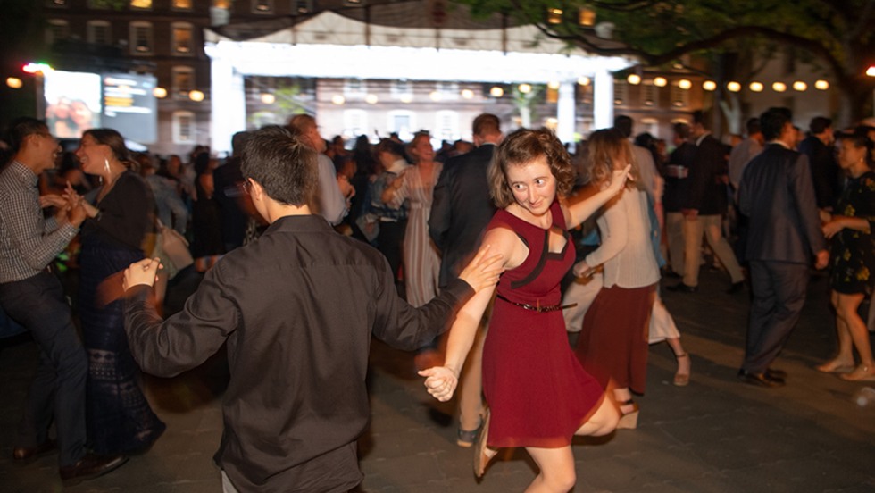 a couple dancing, a woman in red dress