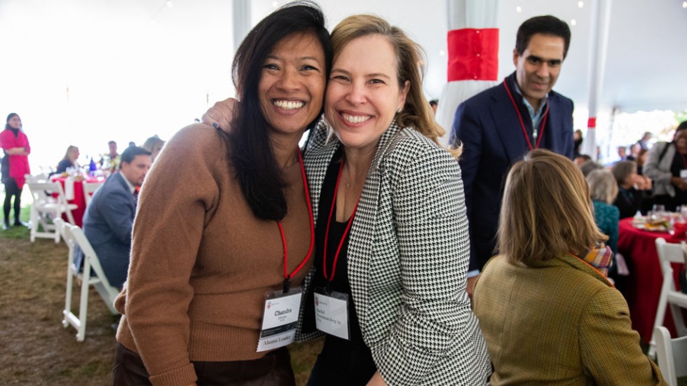 Rachel K. Berg '93, P'23 and Chandra R. Metzler '95, P'26 smiling together at the State of the University event 