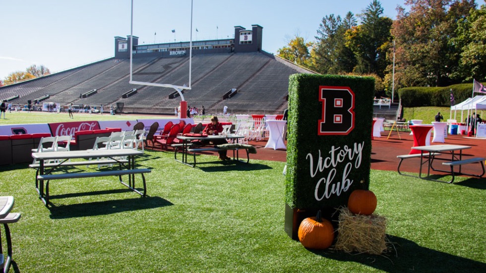 Setting up for the Victory Club event in the end zone at Brown Stadium 