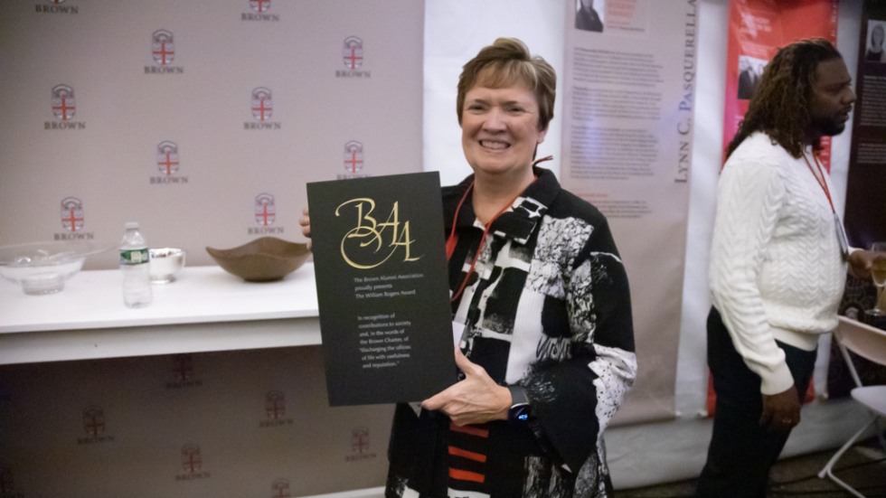 Lynn C. Pasquerella PhD’85 holding her award