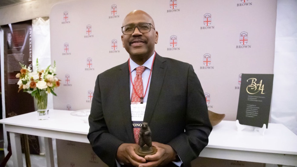 Preston C. Tisdale '73, P'10, P'10 MPH'16 MD'16, P'12 holding his award 