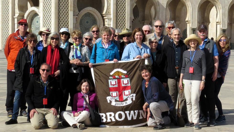 Alumni posing with Brown University banner in Casablanca, Morocco