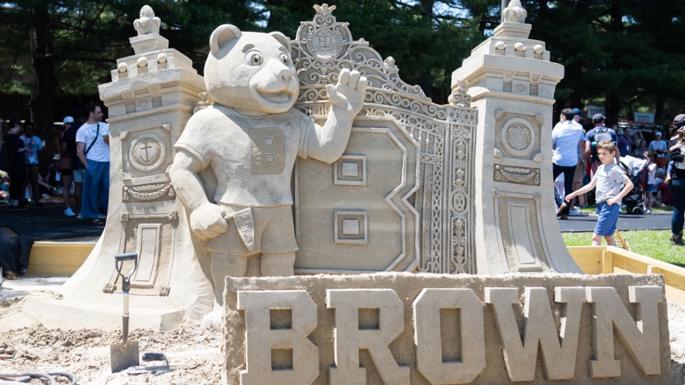 A sand sculpture with Bruno, the Van Wickle Gates, and Brown lettering