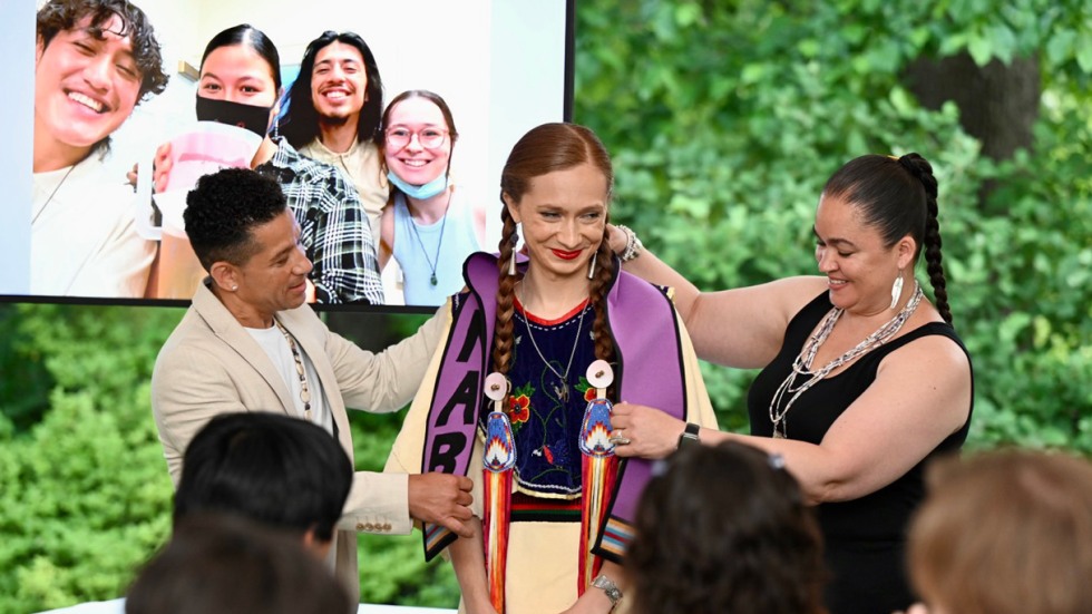 A graduating student receives a stole during the Native American Brown Alumni event