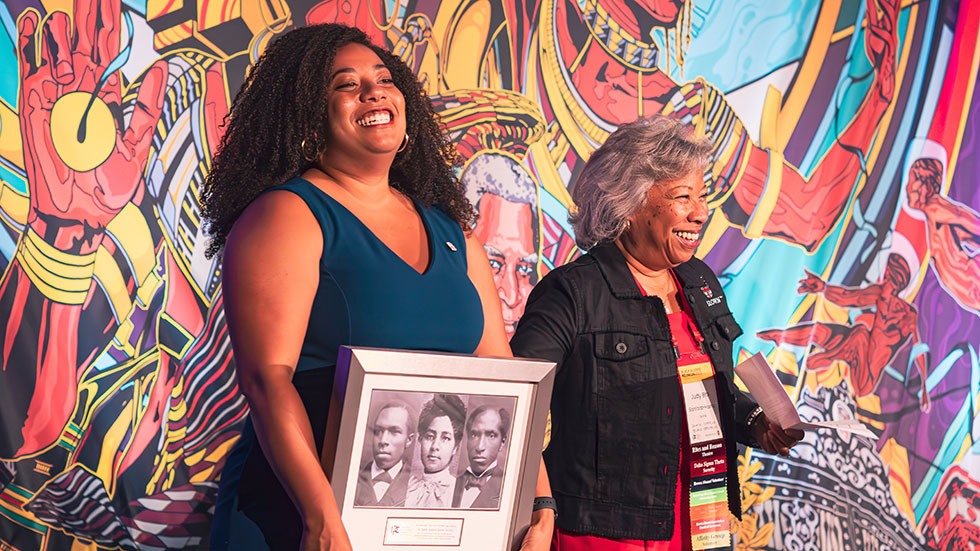 Judy Sanford-Harris ’74, P’14 accepts the Inman Page Black Alumni Council (IPC) Black Legacy Award with her daughter Stephanie Harris ’14 by her side. 