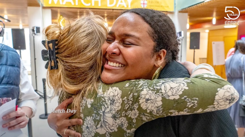 medical school graduate embracing at Match Day celebration