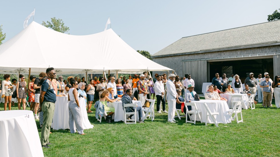 A white tent and barn set the scene for the Bruno on the Vineyard event.