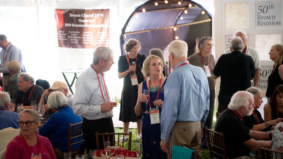 alums talking outside entrance to 50th Reunion tent