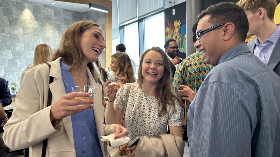 medical students talking at laughing at stepping up ceremony