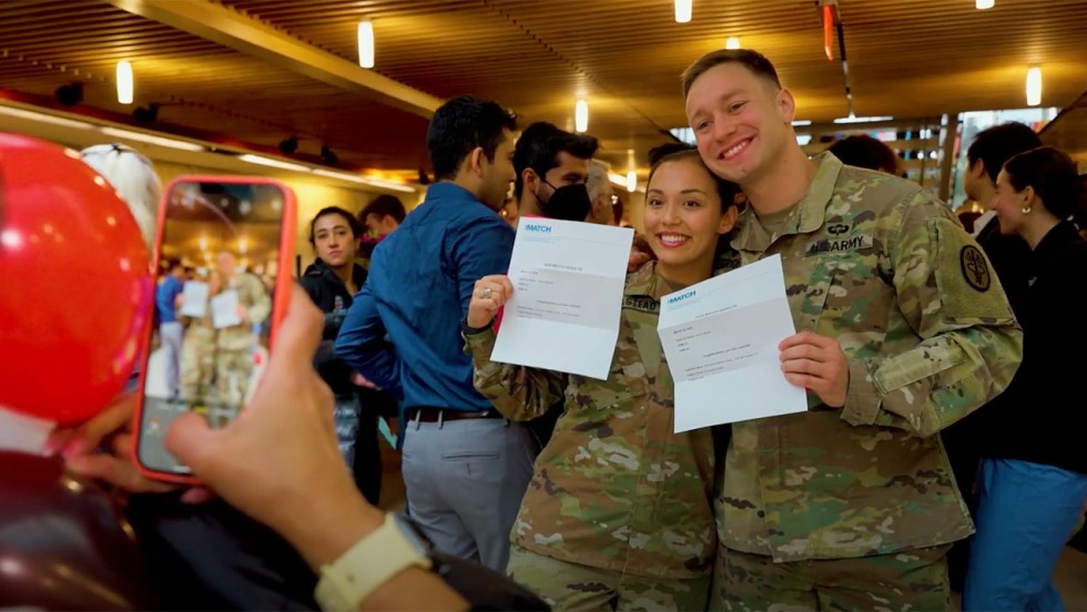 Military-affiliated medical school graduates posing for a picture