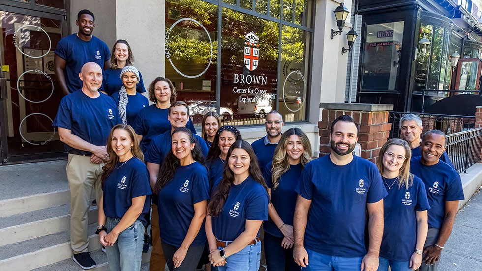 A group of staff posing together in front of the Center for Career Exploration