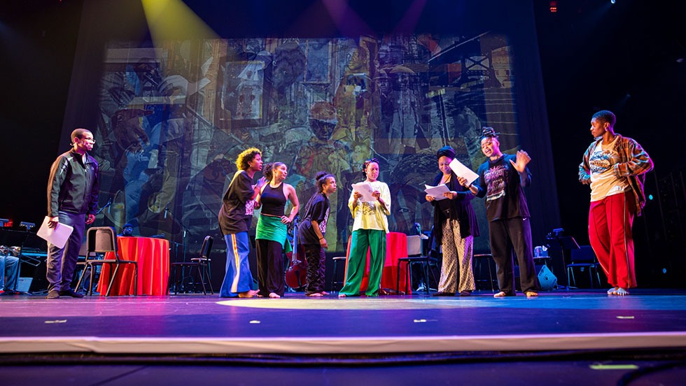 A group of people perform on stage