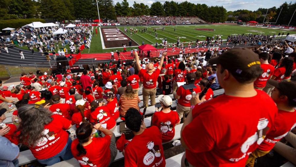 Brown Band alumni cheer during a football game against Harvard in 2024.