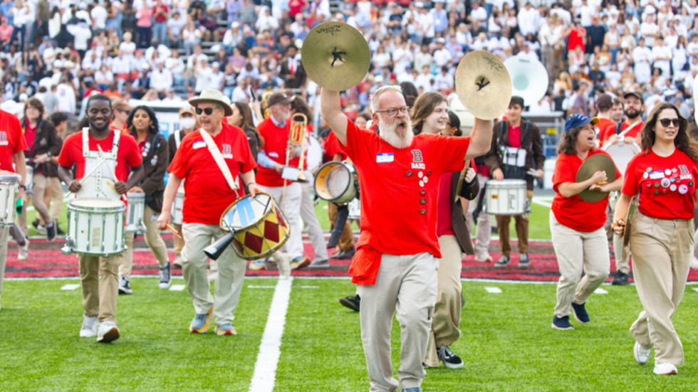 Nearly 200 band alumni spanning seven decades performed in the halftime show during Brown's first home game against rival Harvard, an effort organized to celebrate the Brown Band's centennial