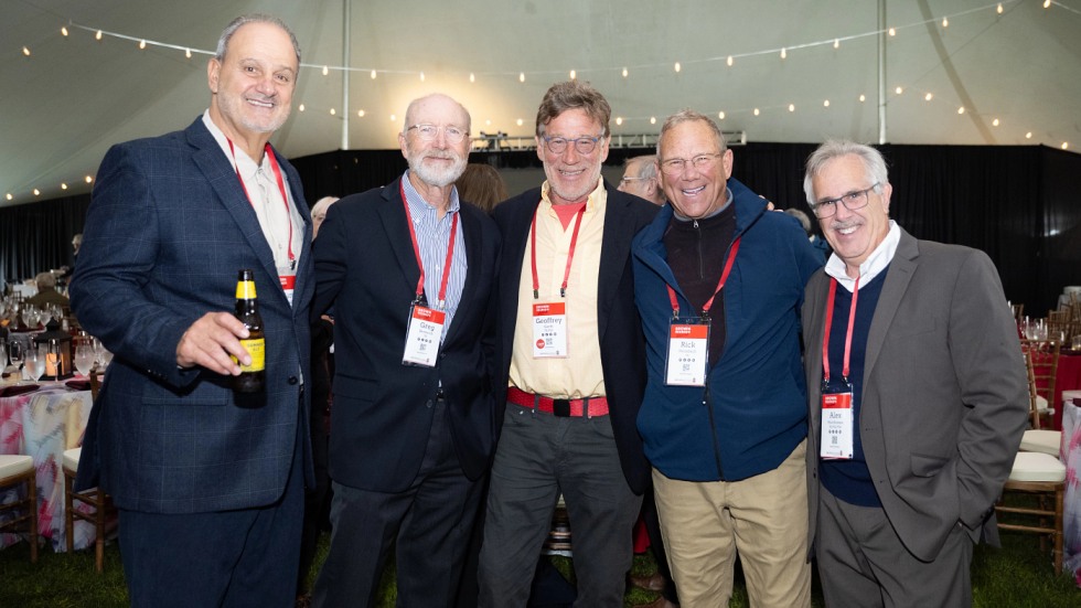 group of alums posing for a photo