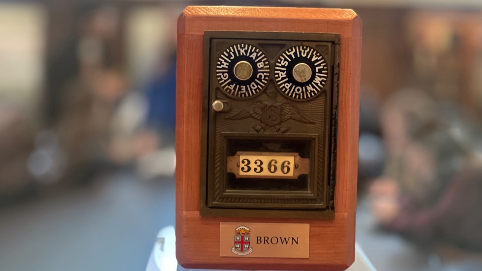 A close-up of the wooden coin banks with a blurred background. 