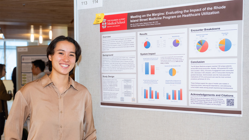 Alex Jin ’23 MD’28 with her research poster detailing the impacts of street medicine on healthcare utilization in Rhode Island. 