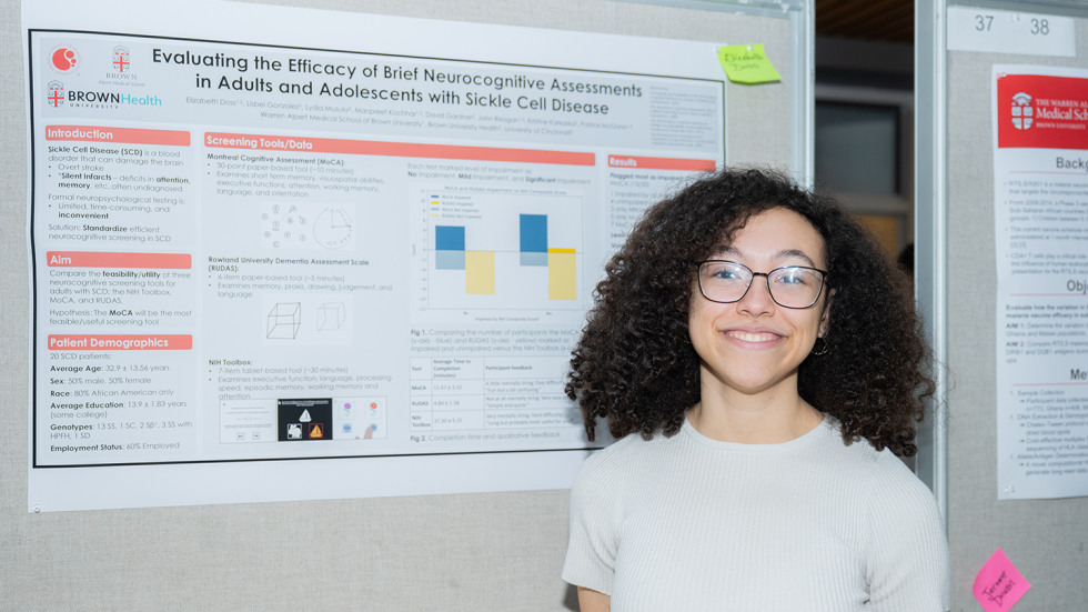 Elizabeth Doss ’24 MD’28 with her research poster on neurocognitive assessments with individuals with sickle cell disease