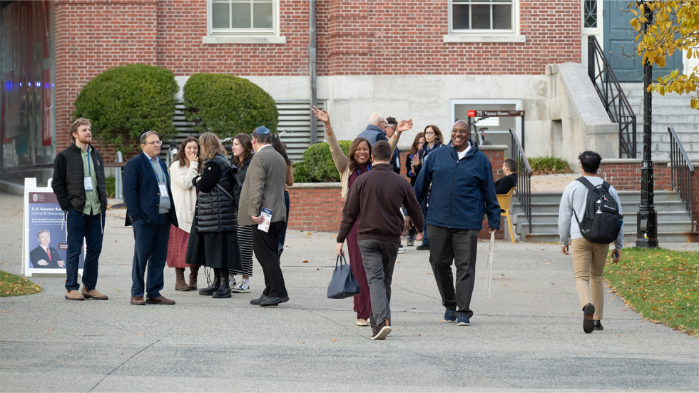 A group of friends reuniting on campus