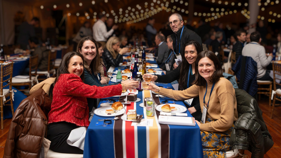 Friends posing for a photo at the shabbat dinner