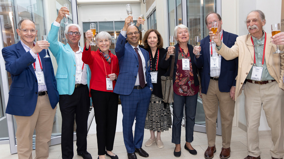 The MD Class of 1976 raising glasses in celebration