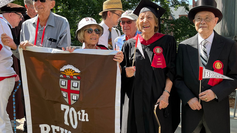 Richard Yen with other members of his class holding a 70th Reunion banner
