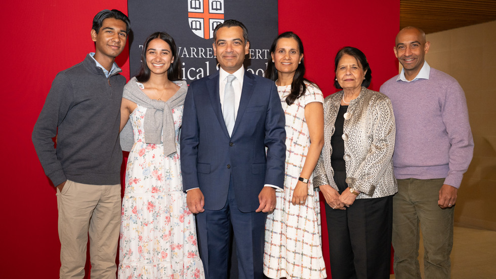 Amit Joshi posing for a photo with his family.