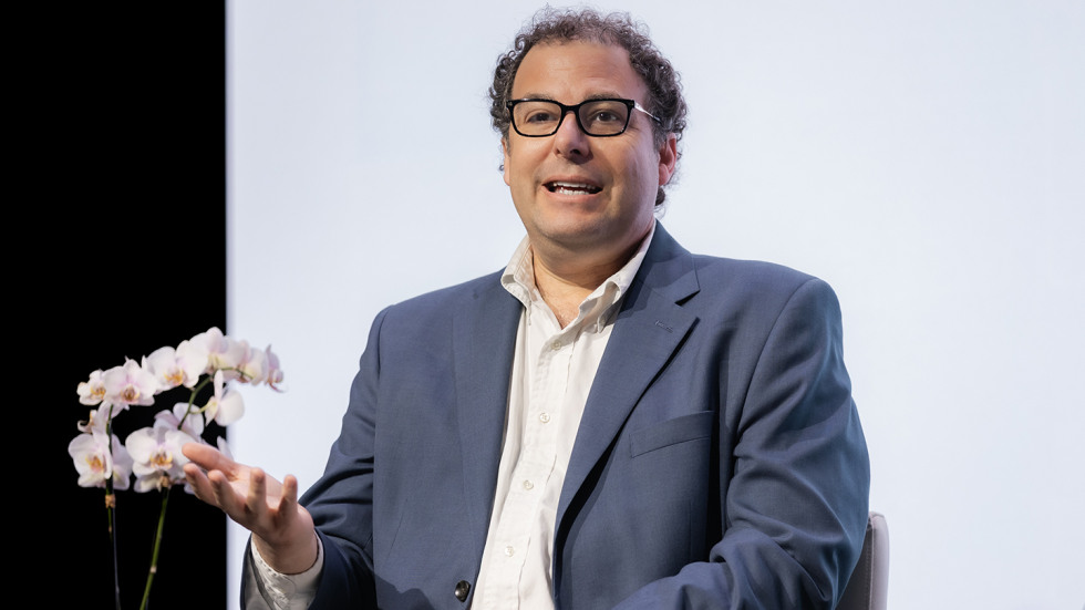 Michael Littman speaking while on stage.