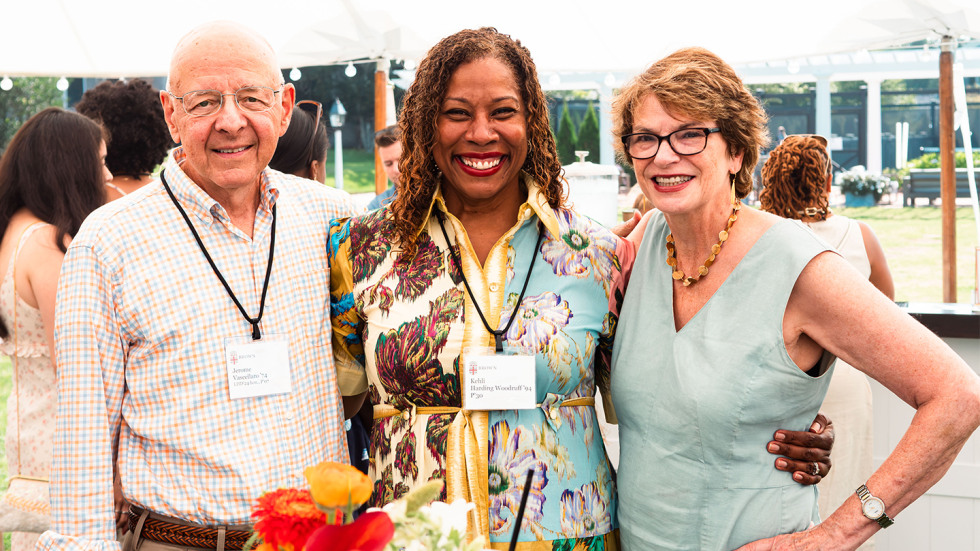 Brown President Christina H. Paxson stands posed for a photo with Jerome Vascellaro and Kehli Harding Woodruff.