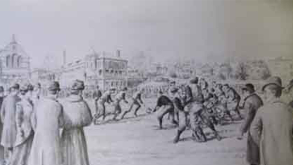 A sketch of a football game. Spectators are in the foreground, as a game plays in the center. In the far background are campus buildings.